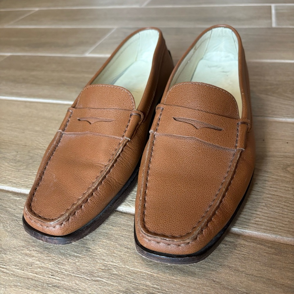 Tod’s tan leather slip-on penny loafers